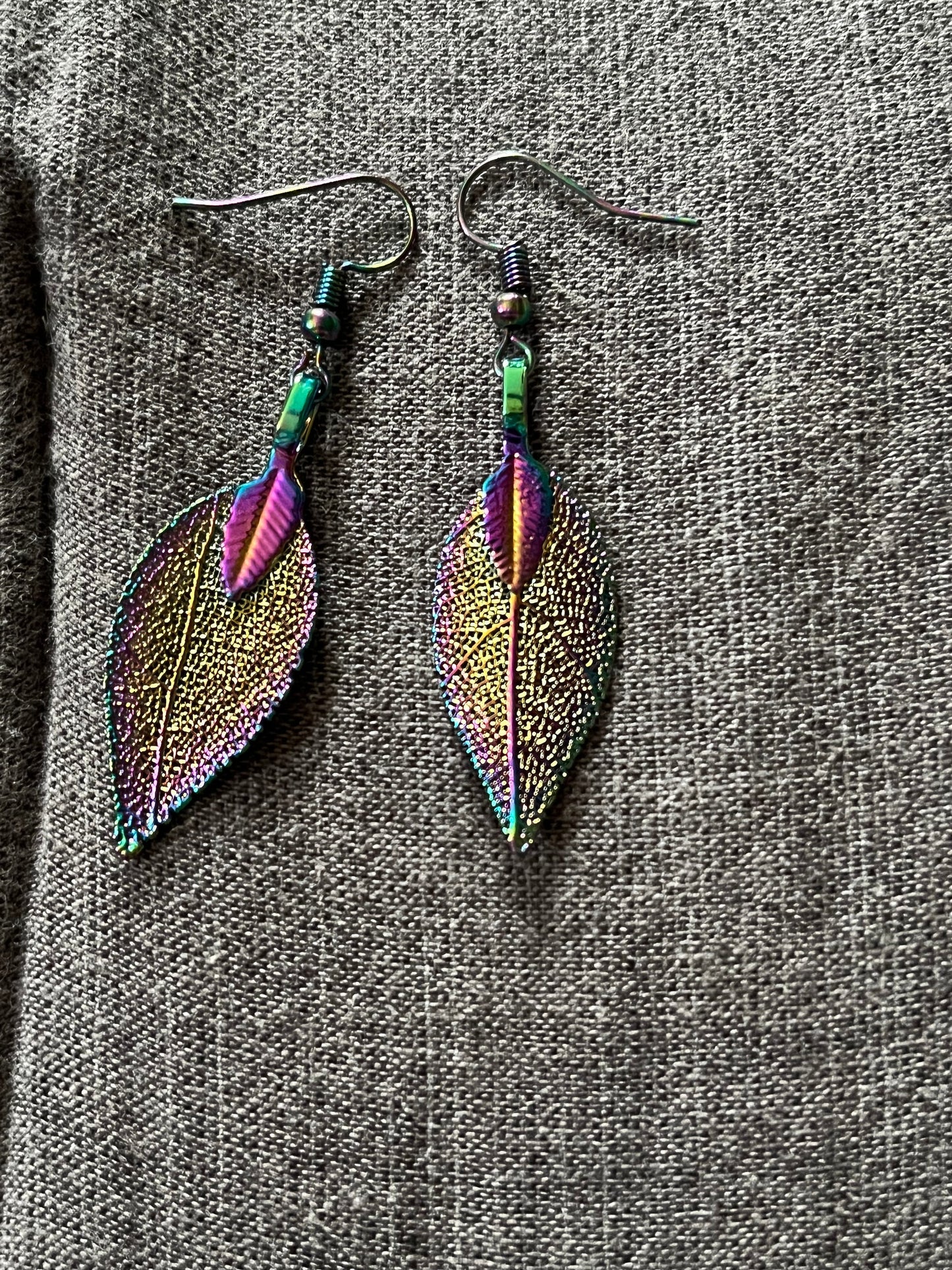 Stainless steel rainbow leave earrings that reflect the light very well when it hits just right