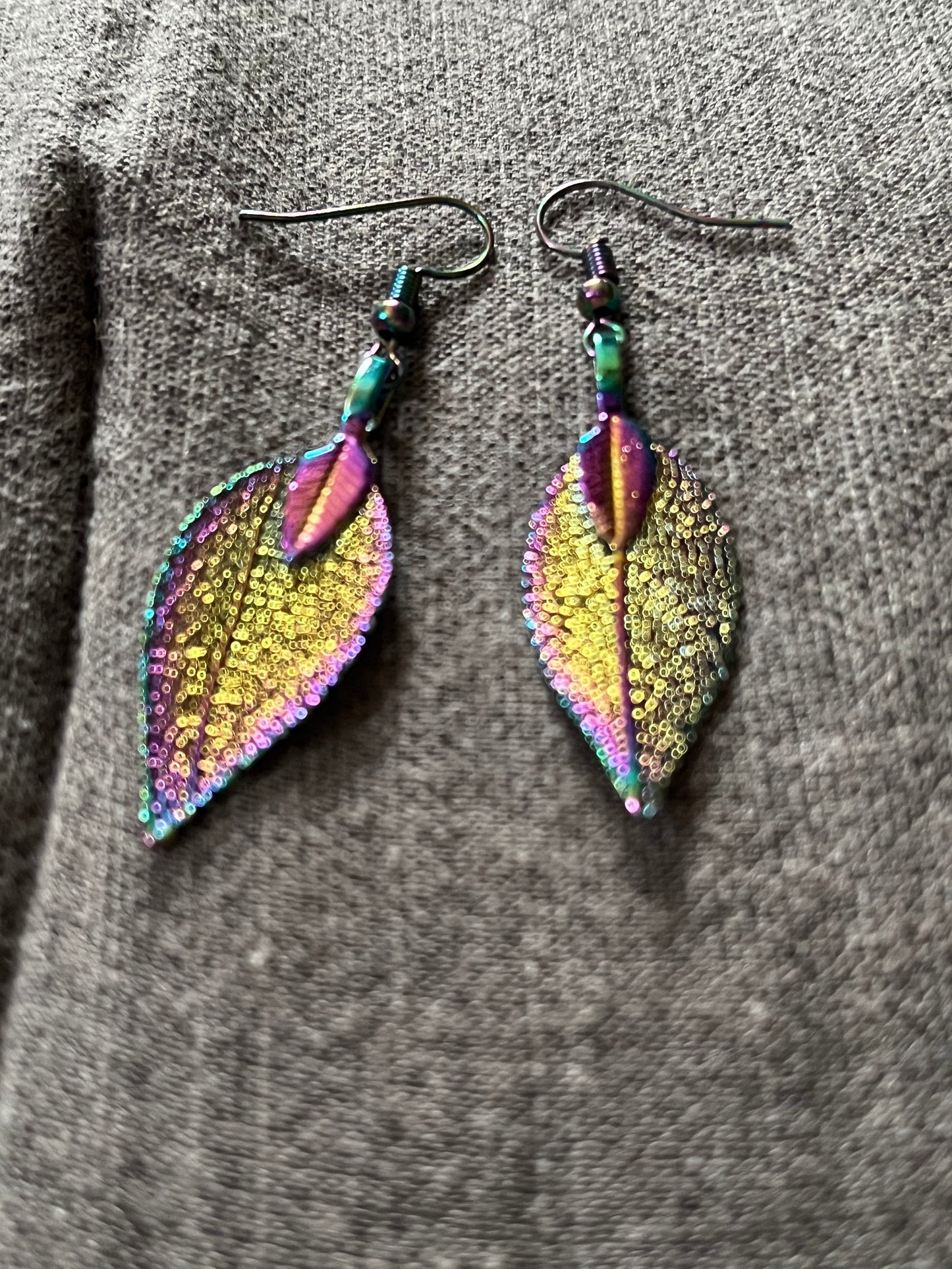 Stainless steel rainbow leave earrings that reflect the light very well when it hits just right