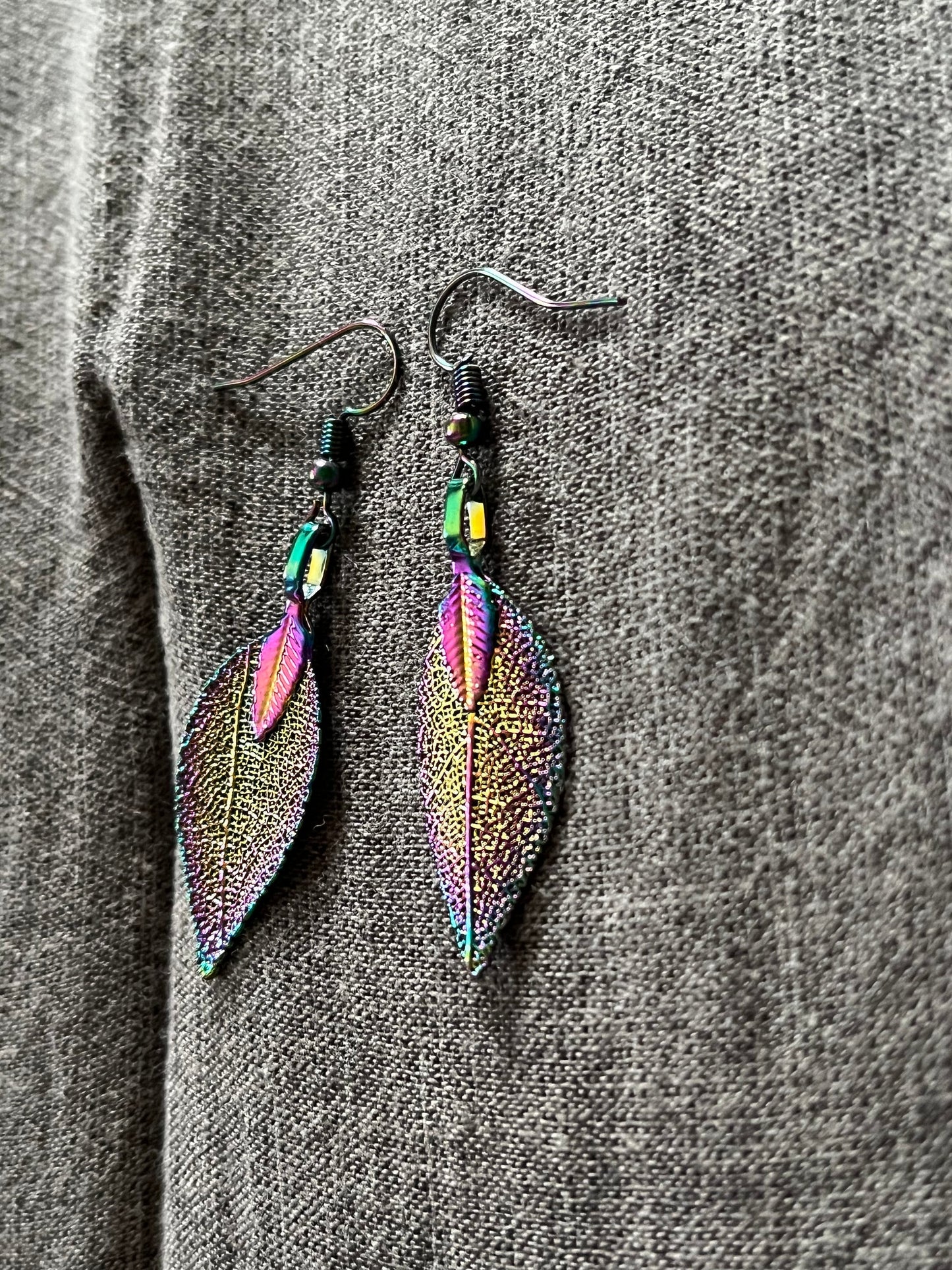 Stainless steel rainbow leave earrings that reflect the light very well when it hits just right