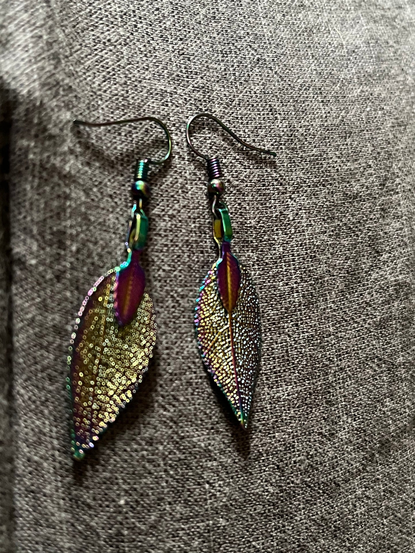 Stainless steel rainbow leave earrings that reflect the light very well when it hits just right